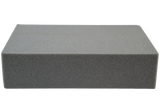 Rectangular open-cell foam block used for general positioning.