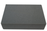 Rectangular open-cell foam block used for general positioning.