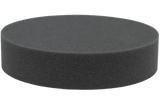 Open-cell foam circular disc which lifts the skull to properly position the spine.