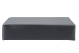 Rectangular clear vinyl-covered open-cell foam block used for general positioning.