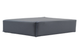 Rectangular clear vinyl-covered open-cell foam block used for general positioning.