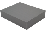 Rectangular Ultrafoam (closed-cell foam) block used for general positioning.