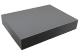 Rectangular open-cell foam block used for general positioning.