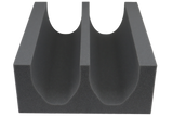 Open-cell foam positioning aid that positions and immobilizes lower extremities during venogram or arteriogram exams.
