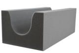 Open-cell foam positioning aid with a contoured cavity to keep a patient’s leg in place. Used with a cast to improve comfort.