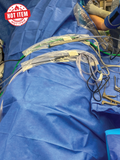 Cord-Management Drape placed on a patient drape with cords routed through it in a neat fashion.