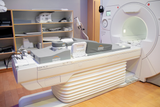 An MRI Machine with the Domico Med-Device Breast Positioning System, a set of foam positioning aids, attached to it.